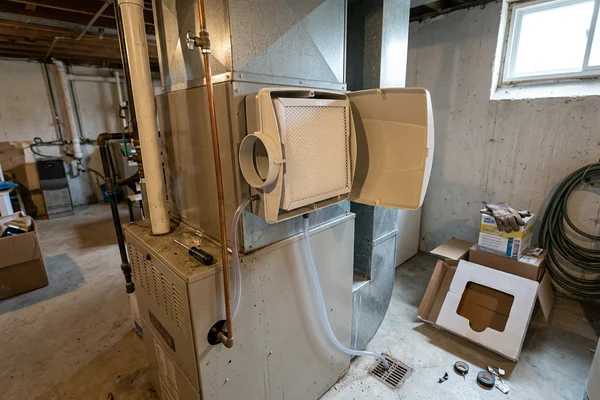 Bypass whole-home humidifier mounted on a furnace supply plenum