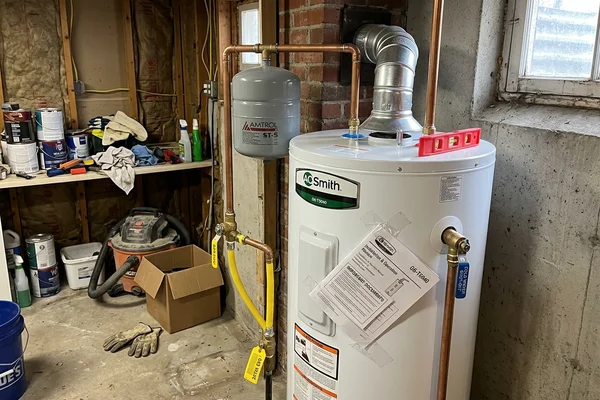 New customer-owned gas tank water heater with clean venting and expansion tank