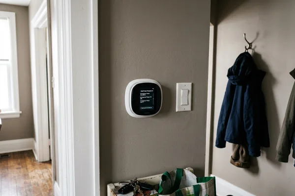 Smart thermostat showing heat pump changeover settings in a Toronto home